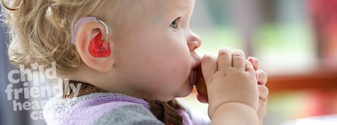 child with hearing aid